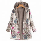 Floral patterned coat with gray lining on a hanger against a white background