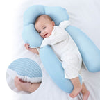 White U-shaped baby support cushion with side handles and a baby resting inside