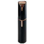 Pink facial hair remover with gold-tone top and central grooming trigger
