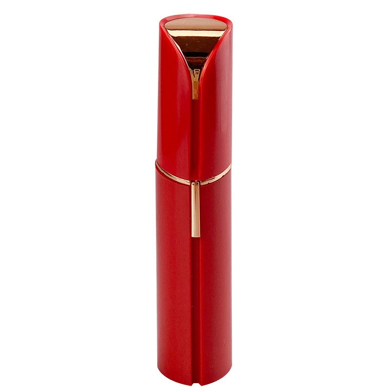 Rose gold facial hair remover with built-in grooming head and charging handle